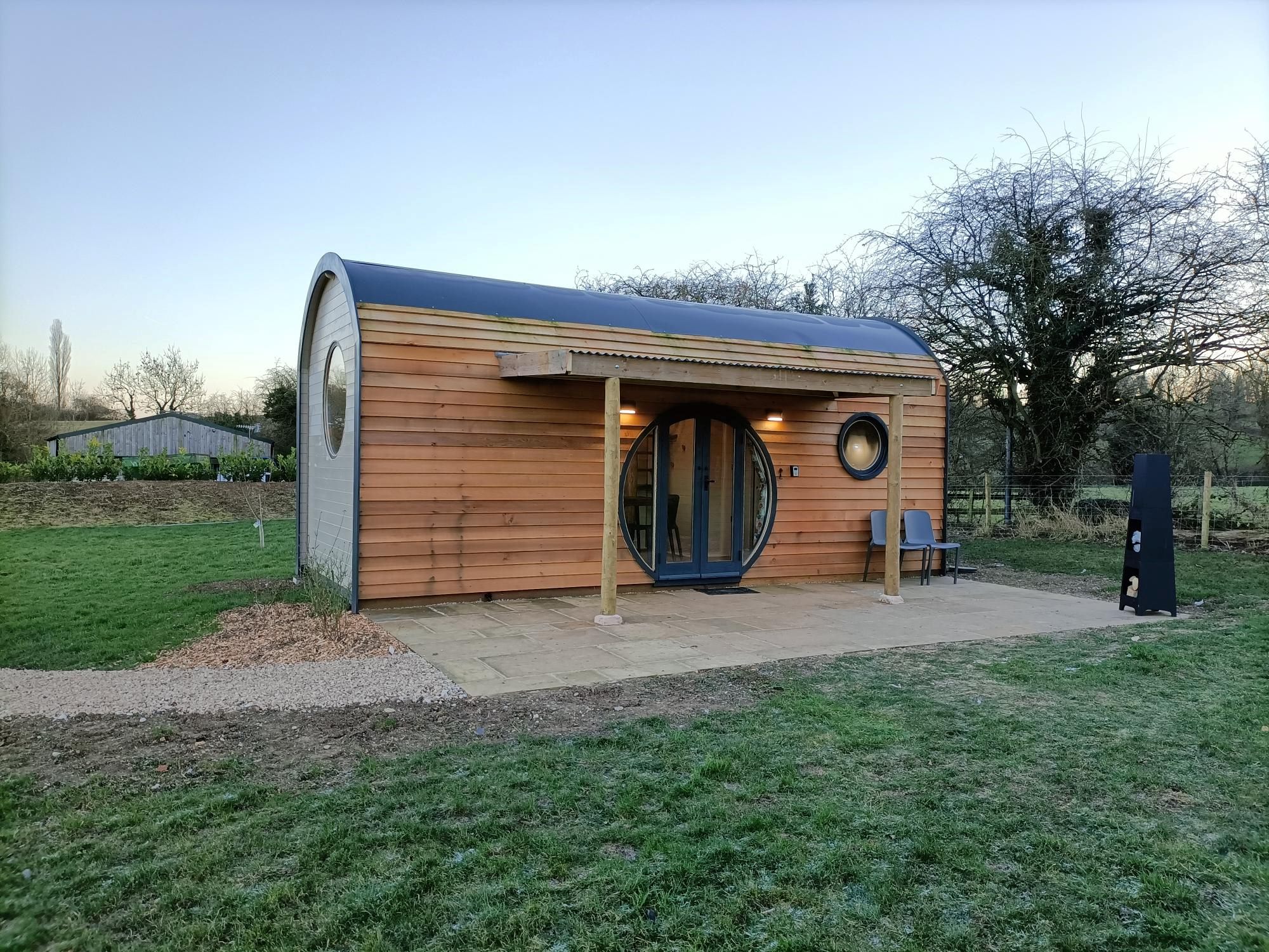 Apple tree pod showing outside lean to and private patio