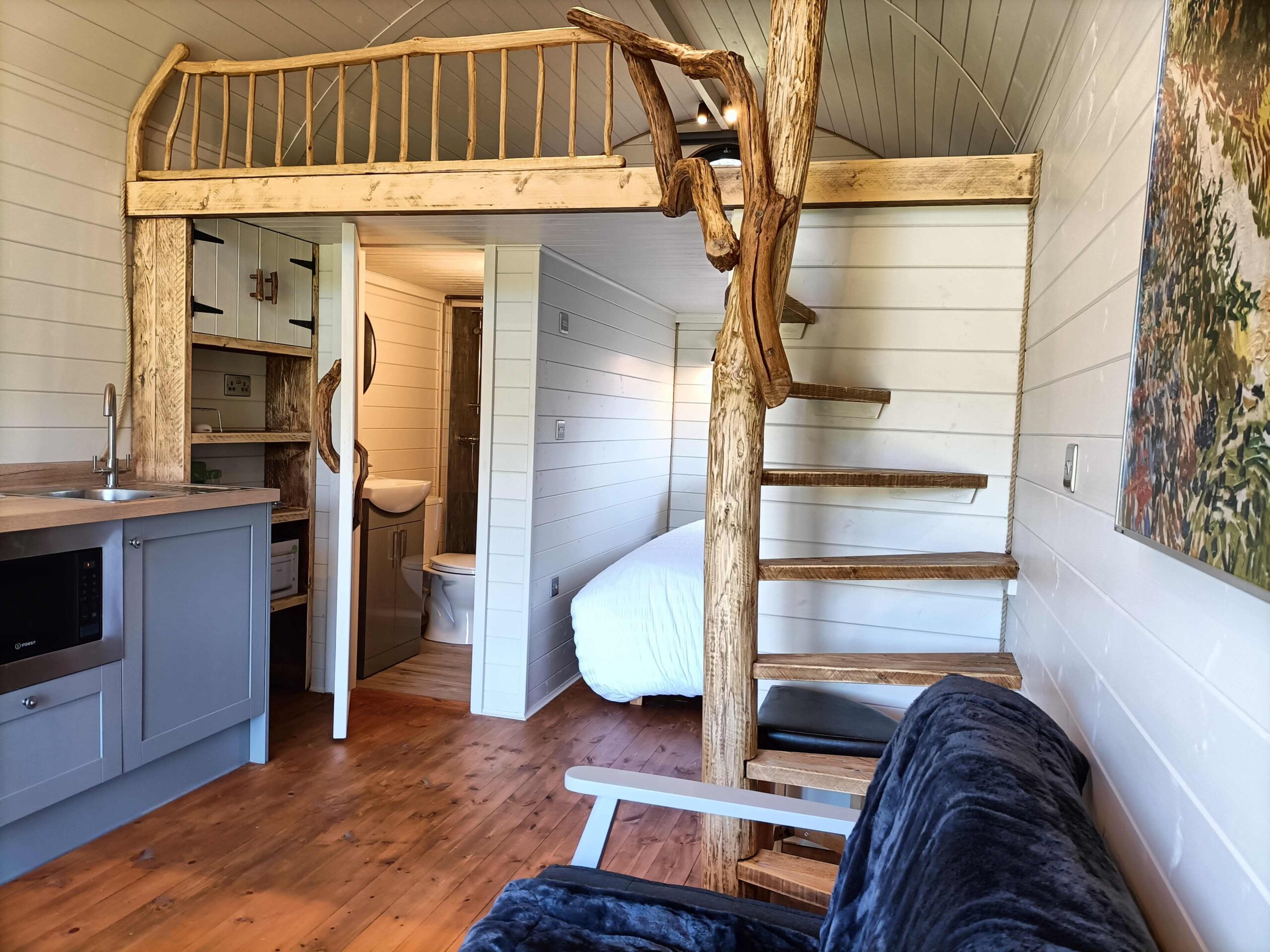 Birch tree pods hand made rustic wood spiral staircase and oak balustrade.